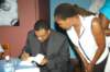 lectureattendeegettingherpurchasedbooksignedbyprofkwamedawes_small.jpg
