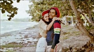 Cindy Breakspeare and Bob Marley on a beach