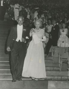 Edna and Norman Manley descending stairs